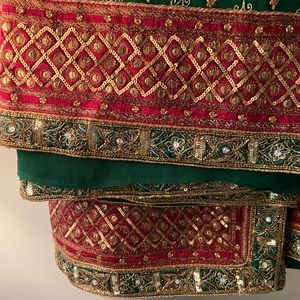 Indian Pakistani saree with heavy work on body.